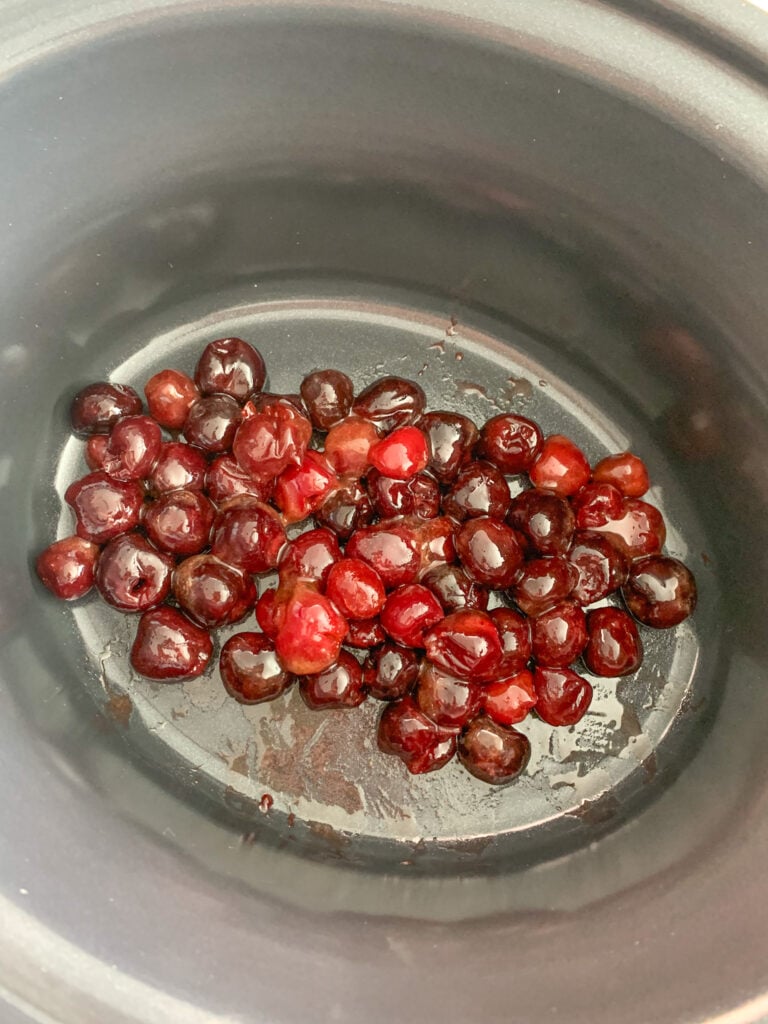honey cherry mixture in slow cooker