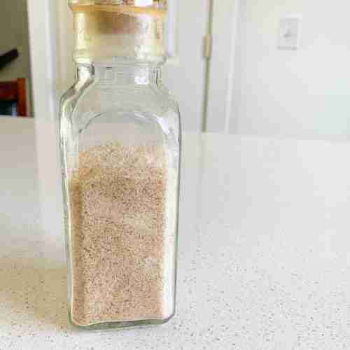 bottle of crumbs on the table