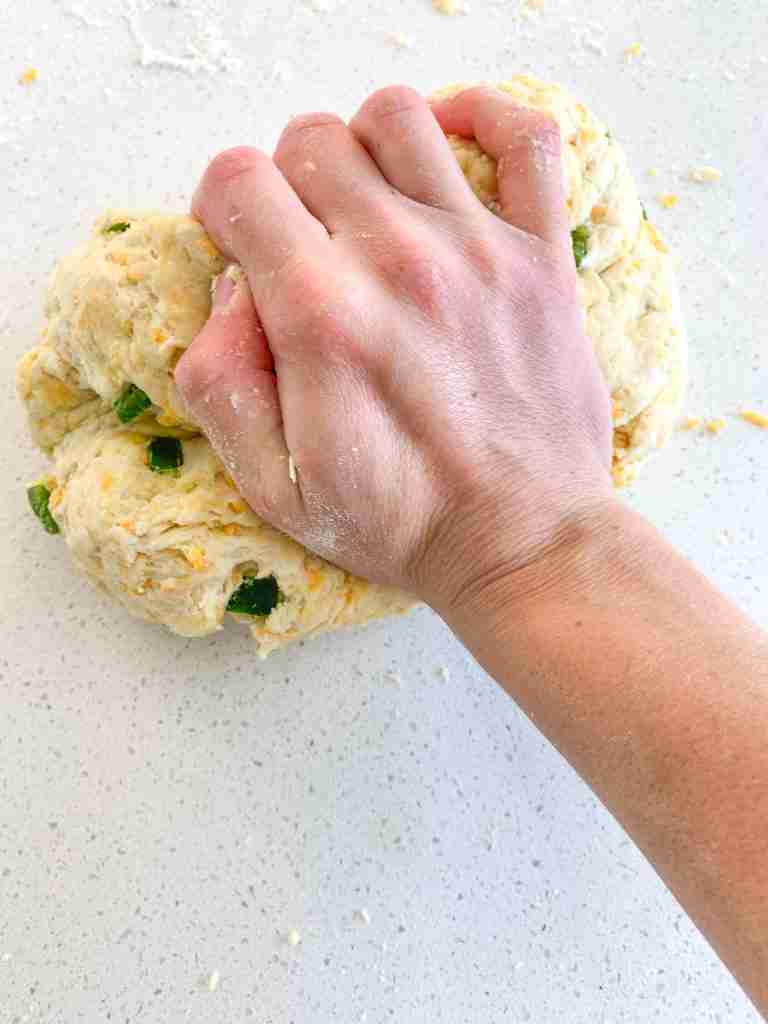 kneading cheese and jalapeno scone dough