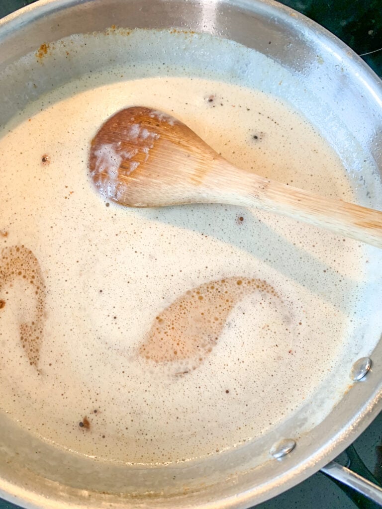 stirring cajun chicken alfredo sauce