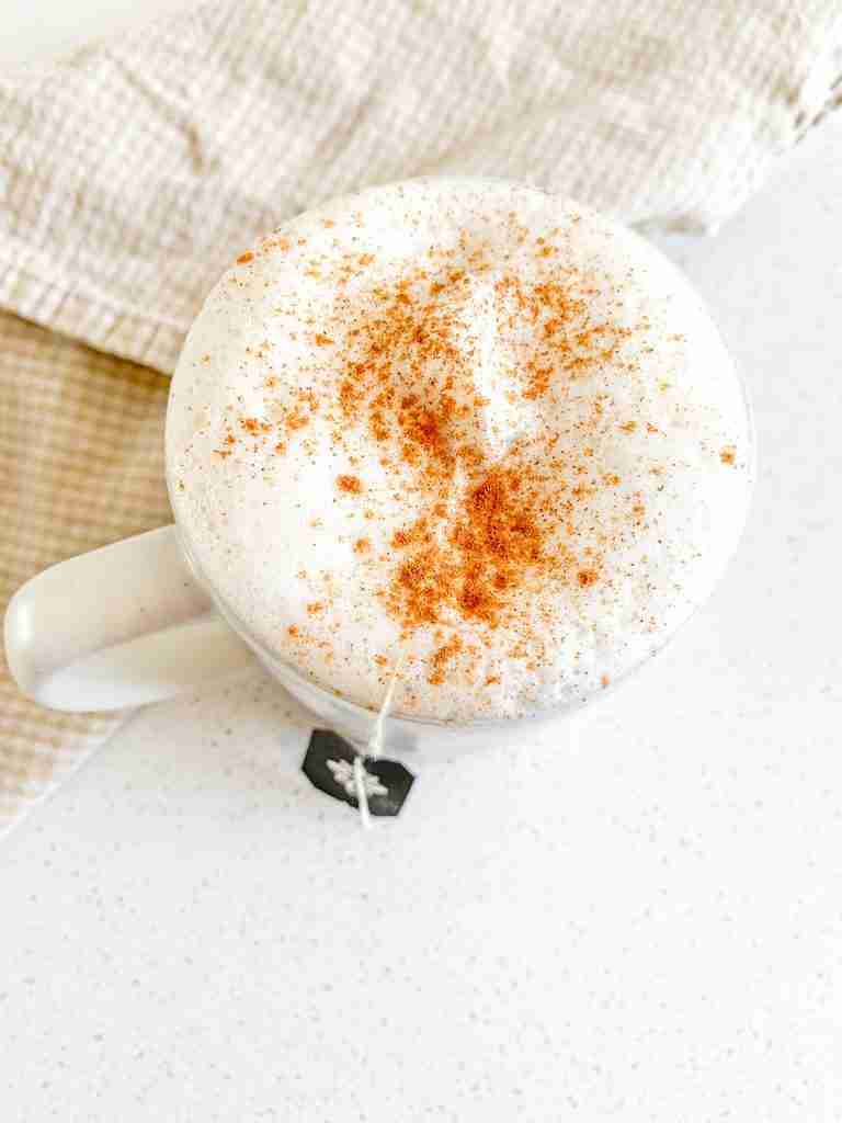 fresh cup of chai tea latte with tea bag