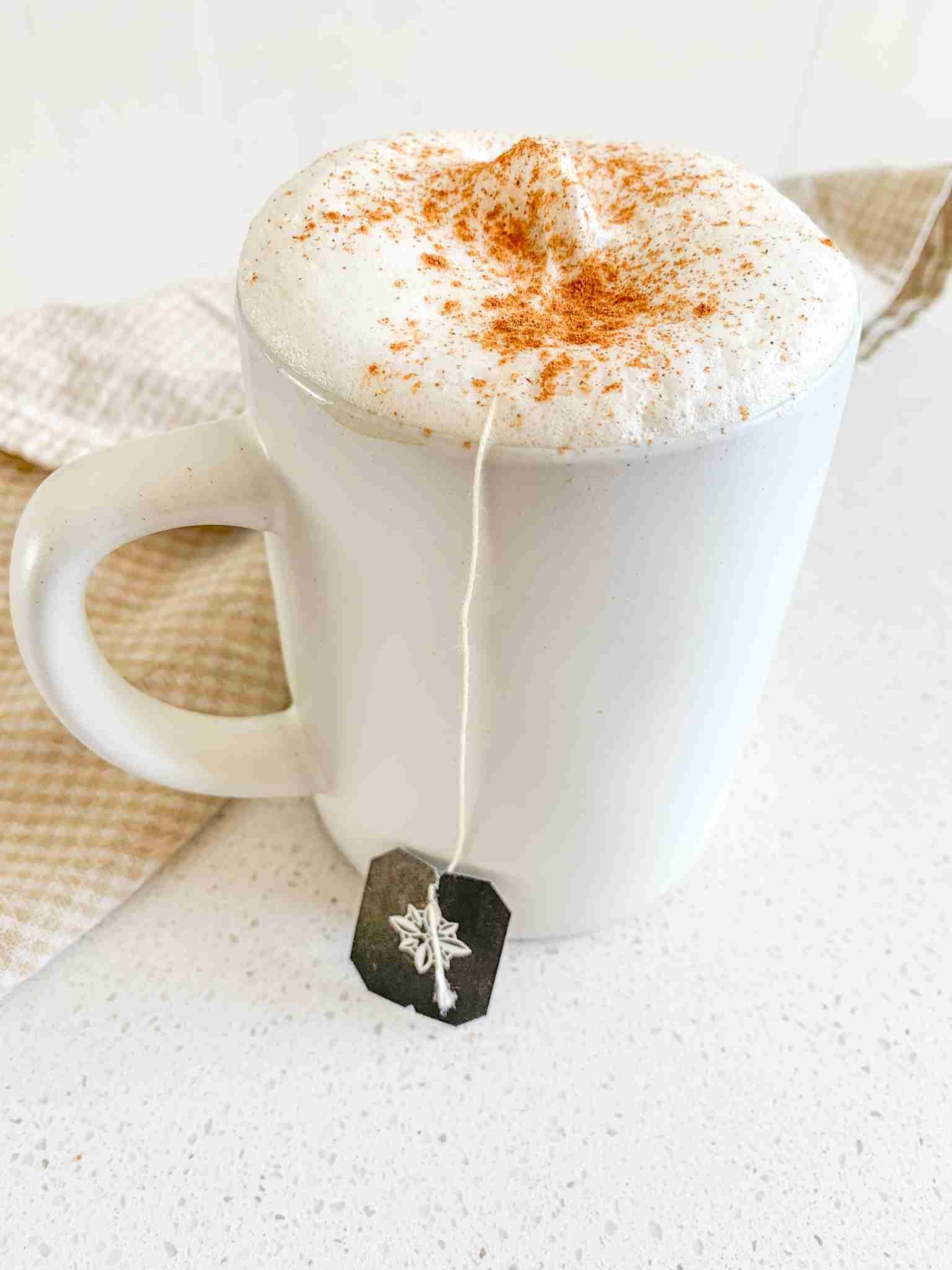 fresh cup of chai tea latte with tea bag