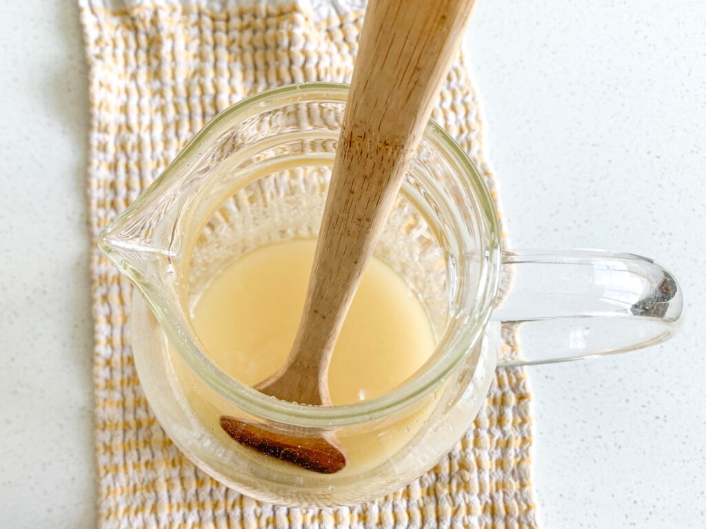 stirring sugar and lemon juice in a pitcher