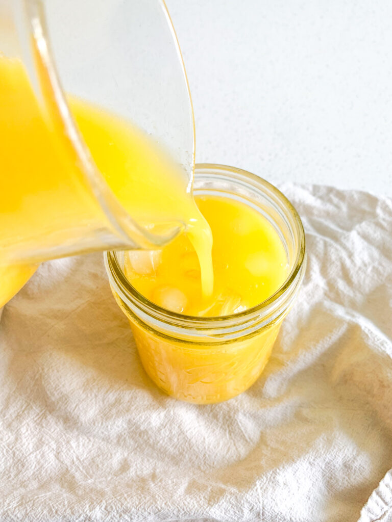 homemade mango lemonade being poured