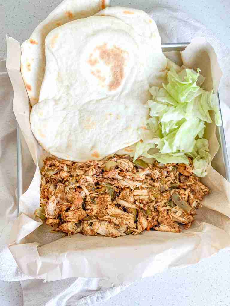 freshly cooked and plated slow cooker chicken fajitas