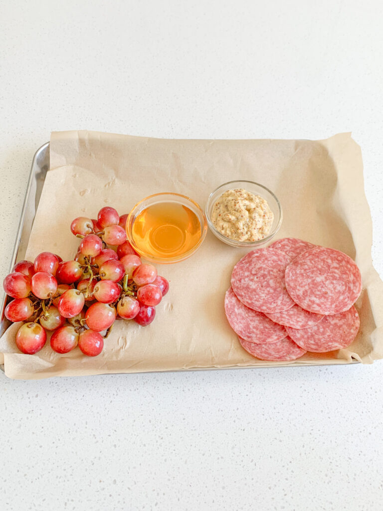 salami added to charcuterie board