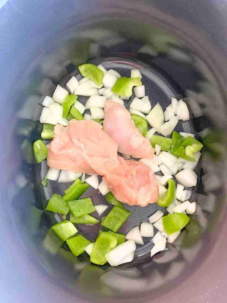 chicken and veggies added to slow cooker