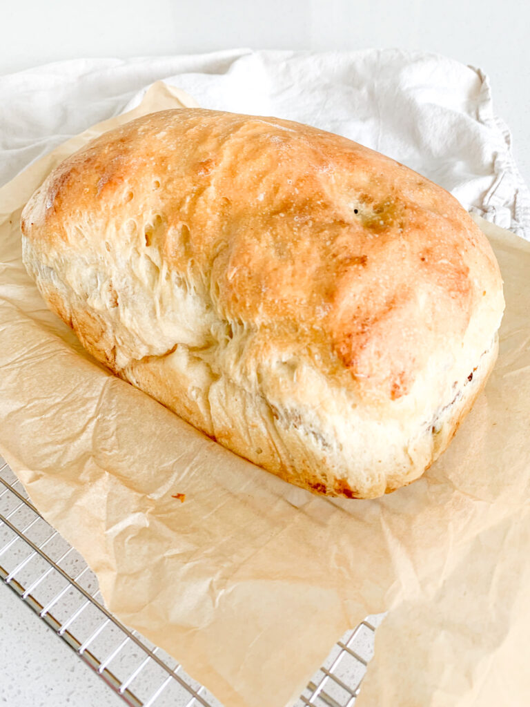 freshly baked and sliced open sourdough cinnamon raisin bread