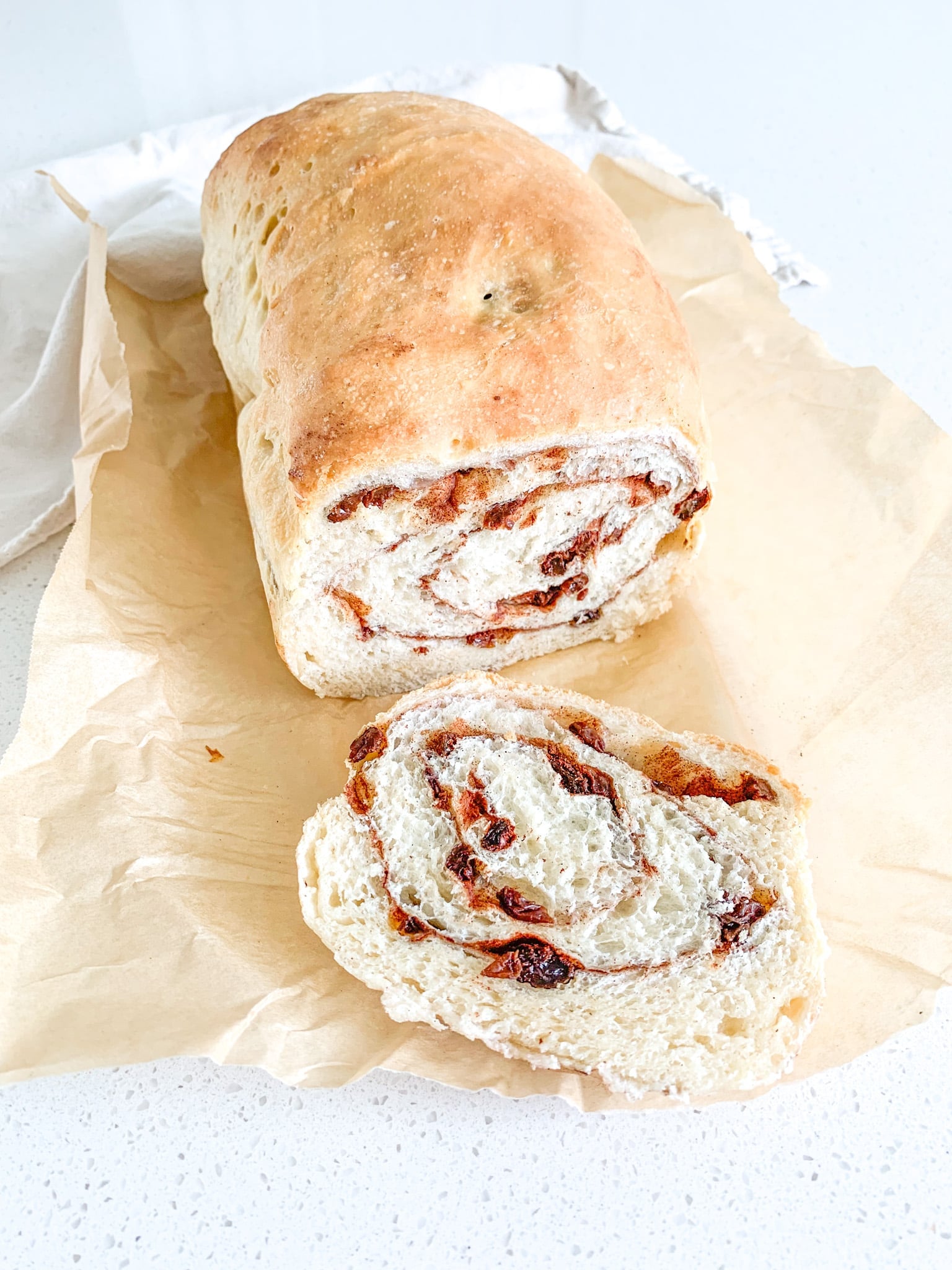 freshly baked and sliced open sourdough cinnamon raisin bread