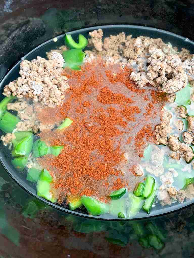 ingredients in the crockpot for stuffed pepper soup