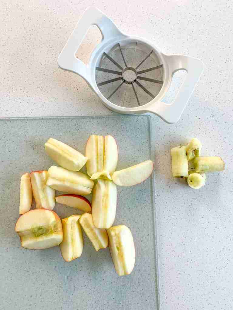 apple being cored and cut up