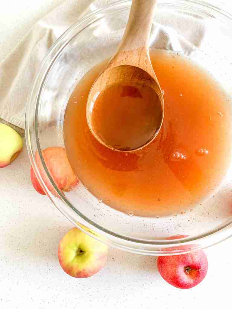 freshly made slow cooker apple cider in a bowl being served