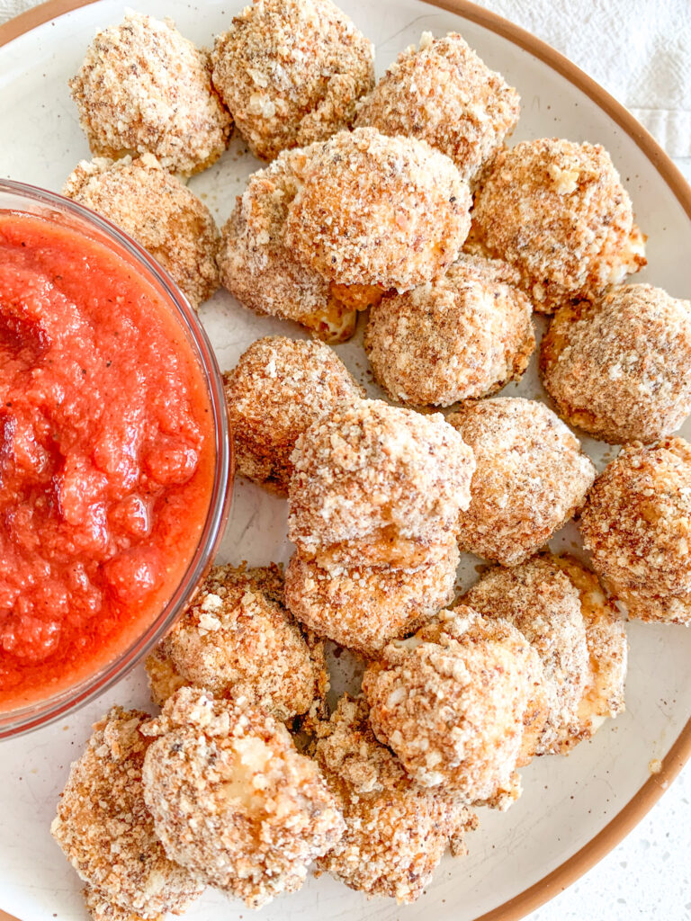 freshly baked mozzarella balls with marinara sauce