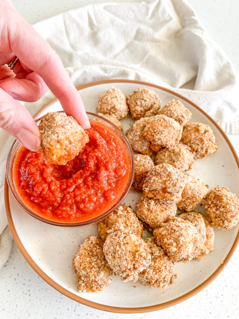 freshly baked mozzarella balls dipped in marinara sauce