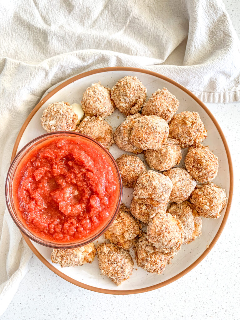 freshly baked mozzarella balls with marinara sauce