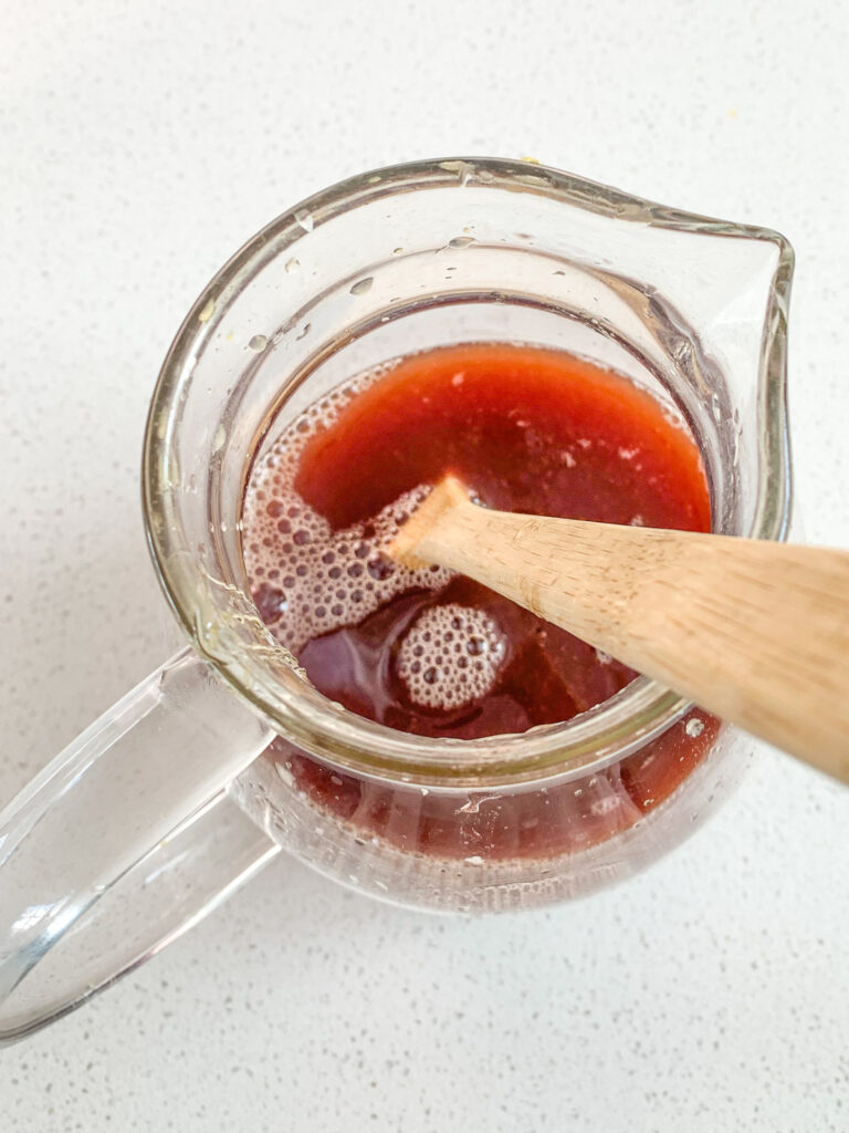 stirring holiday punch base to combine