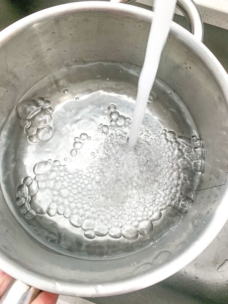 filling up a pan with water for the double broiler