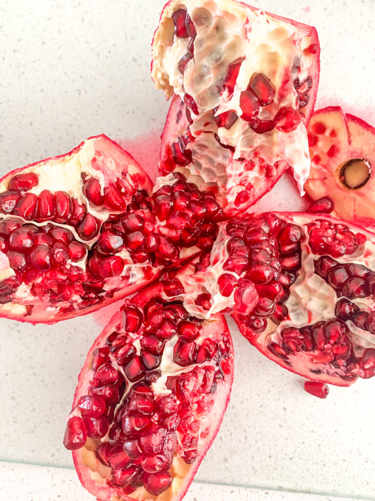 cutting up pomegranate for chocolate bark