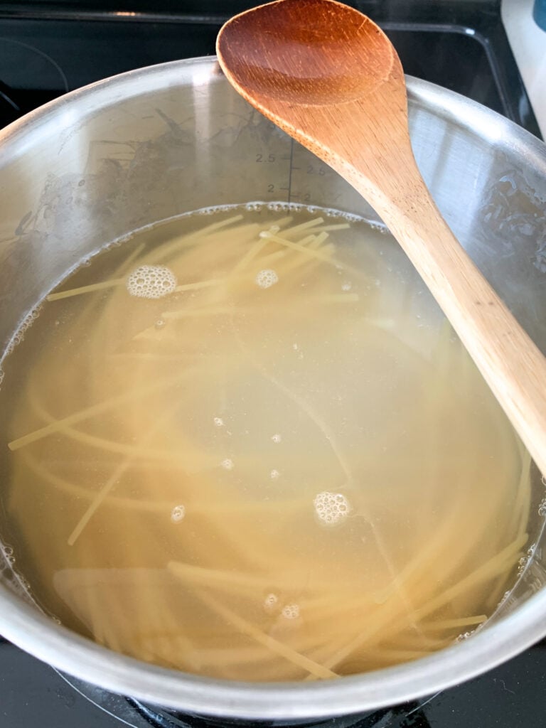 cooking spaghetti in a pot