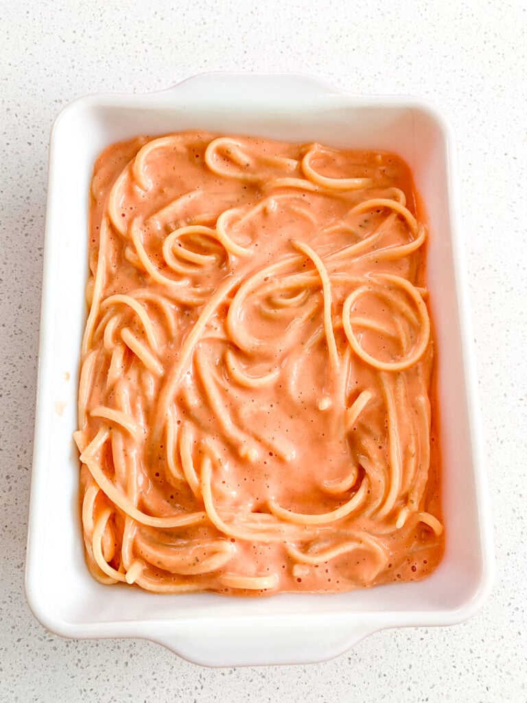 spaghetti and sauce in casserole dish