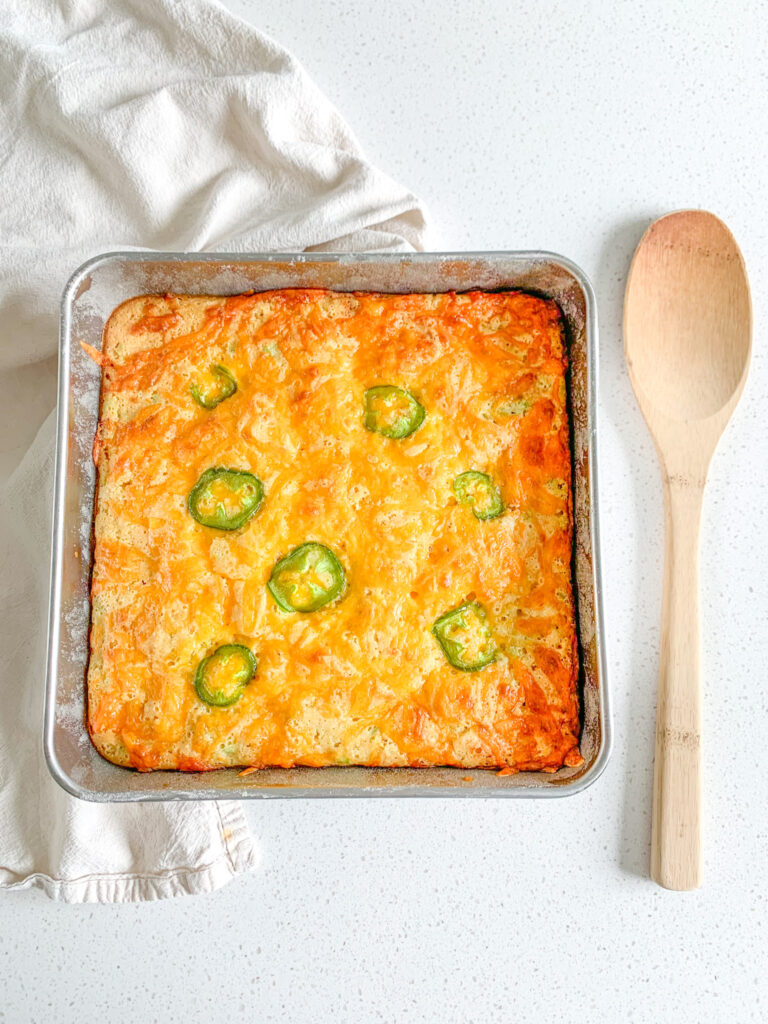 freshly baked cheesy sourdough jalapeno corn casserole ready to be served
