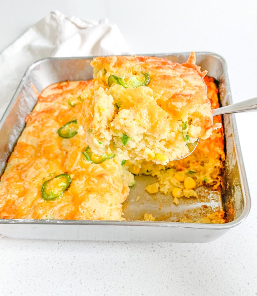 freshly baked cheesy sourdough jalapeno corn casserole getting served