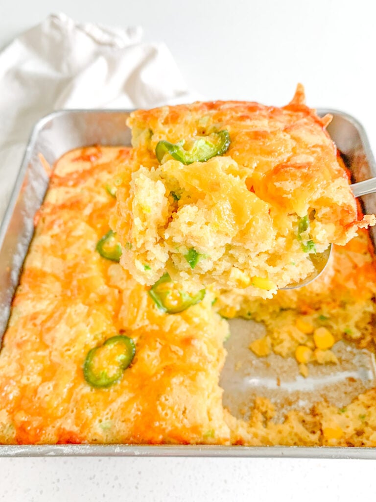freshly baked cheesy sourdough jalapeno corn casserole getting served