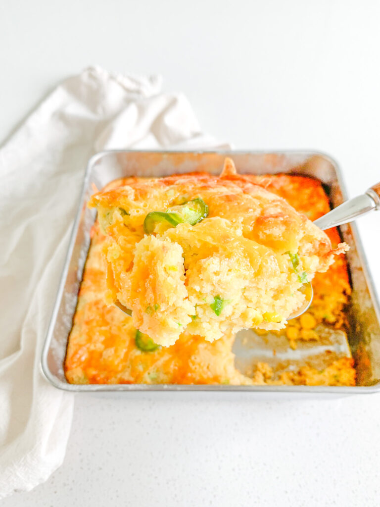 freshly baked cheesy sourdough jalapeno corn casserole getting served