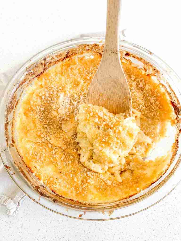spoonful of freshly made cheesy hashbrown casserole
