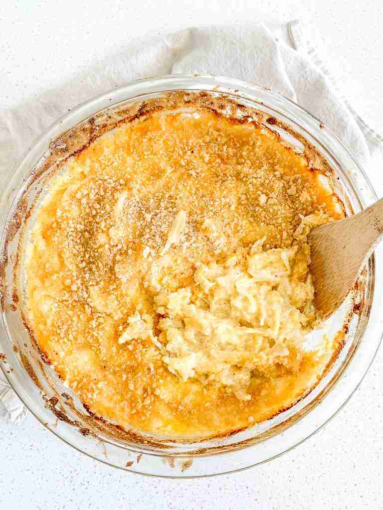 spoonful of freshly made cheesy hashbrown casserole