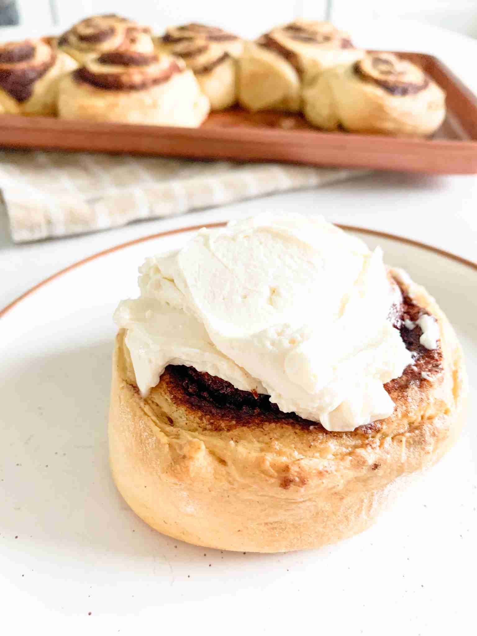 up close cinnamon roll with frosting