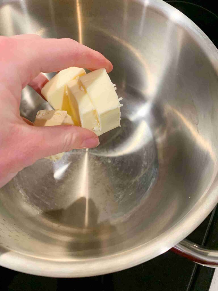 adding butter to saucepan for buffalo sauce