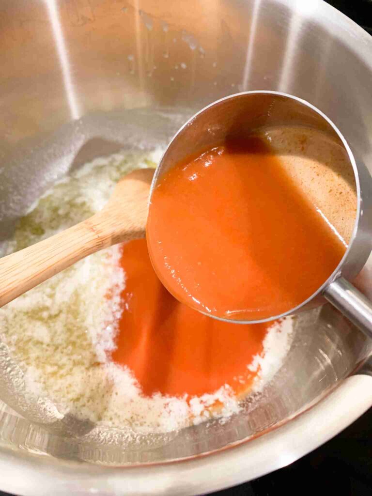 adding ingredients to pan for buffalo sauce