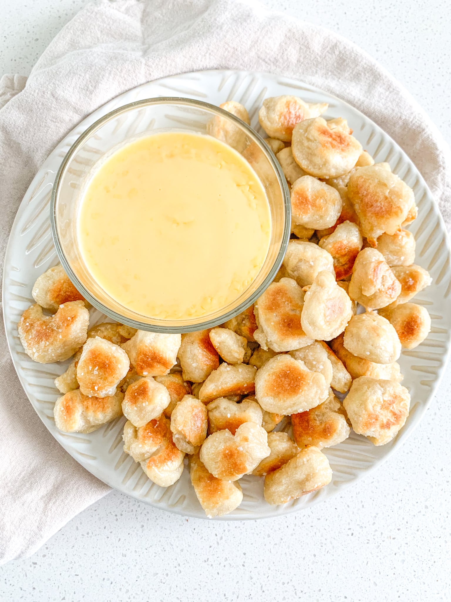 freshly baked sourdough pretzel bites served with cheese dip