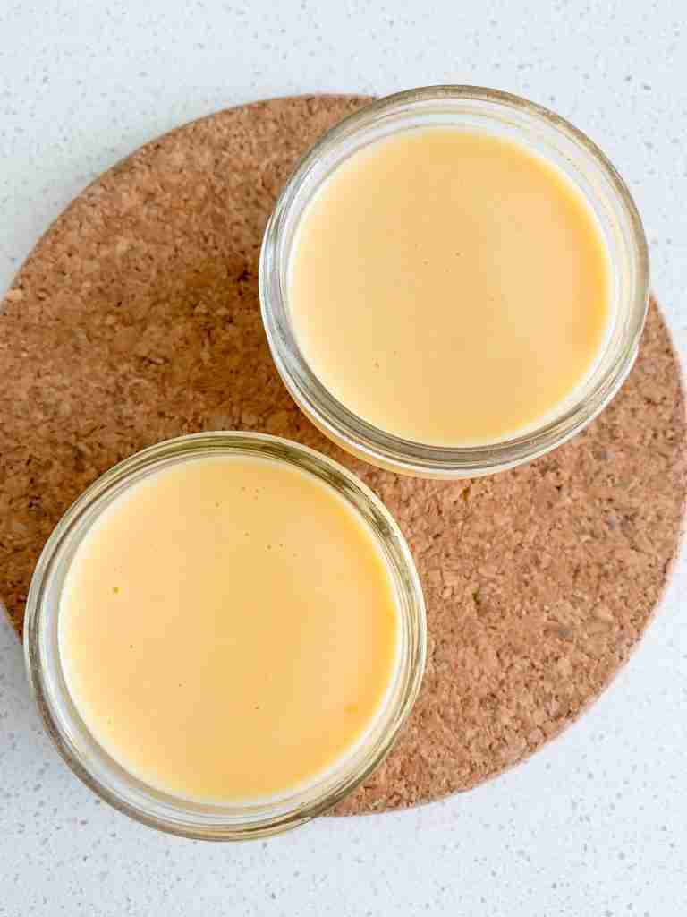 2 cups of cheese sauce on a cork piece