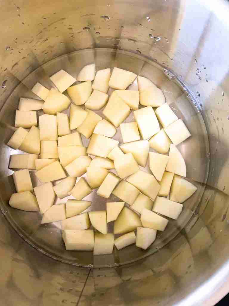 pot full of potato chunks in water