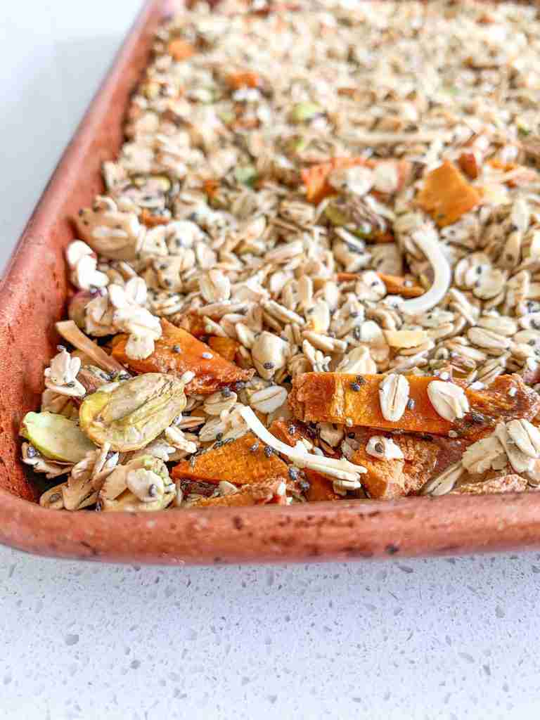 mix of oats, nuts, seeds on a pan