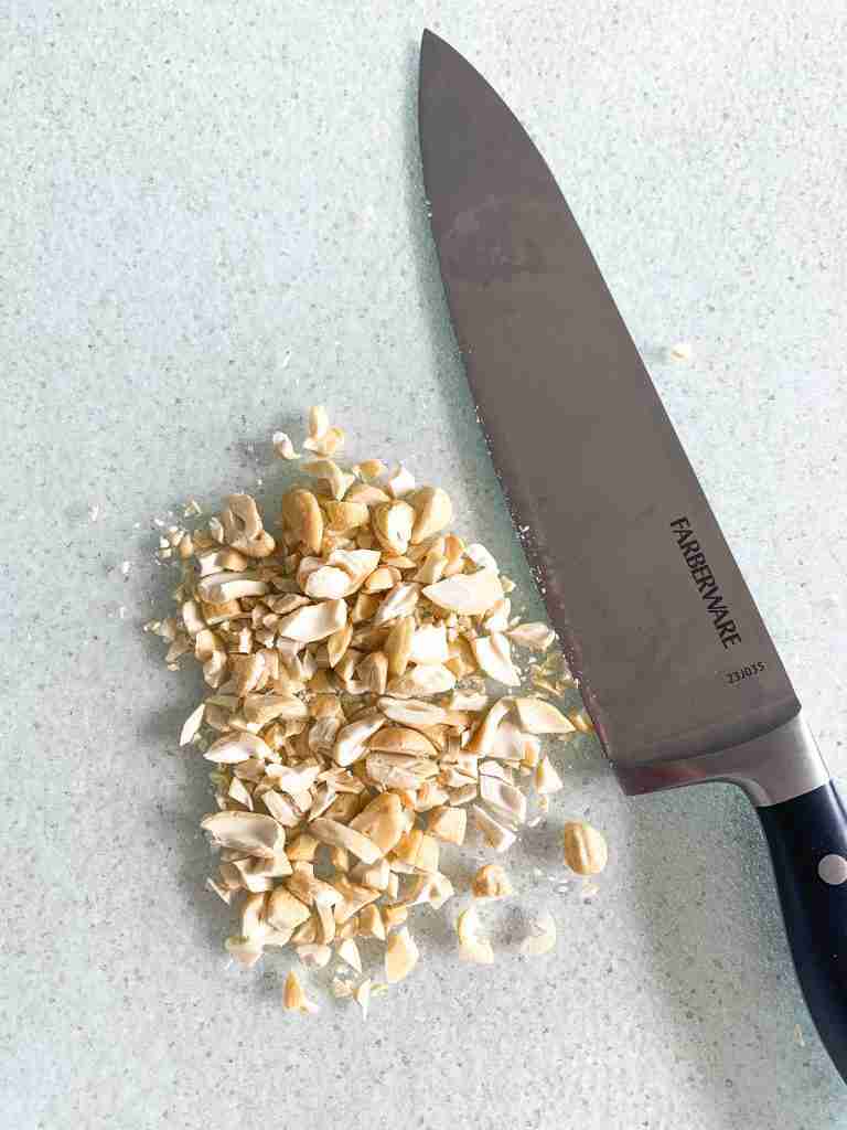 chopping nuts on a cutting board