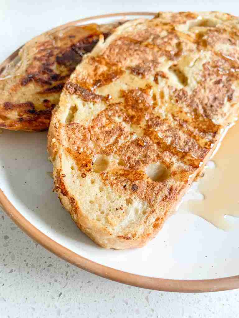 2 slices of toast with syrup covering them