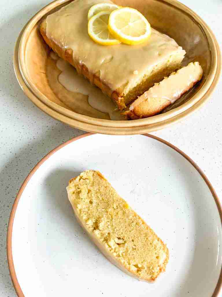 lemon cake and a slice on a plate