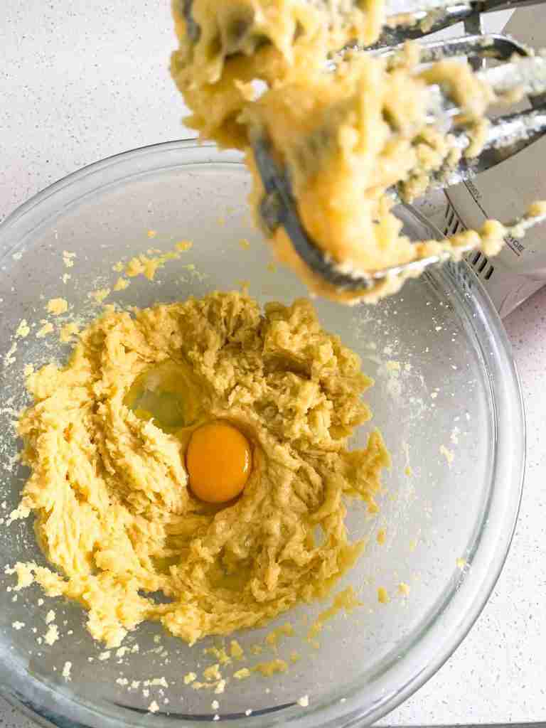 adding in eggs to creamed mixture