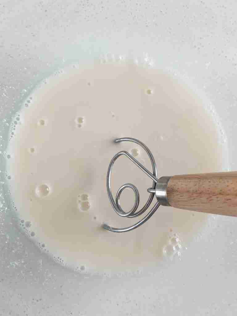 whisk in a liquid mixture in a bowl
