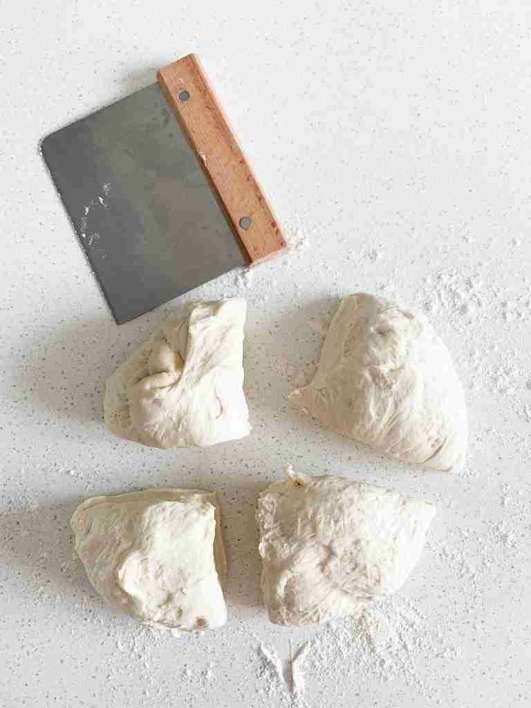 dough cut into 4 sections