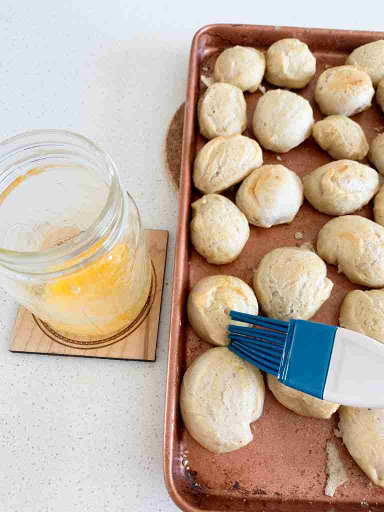 pretzels being brushed with butter