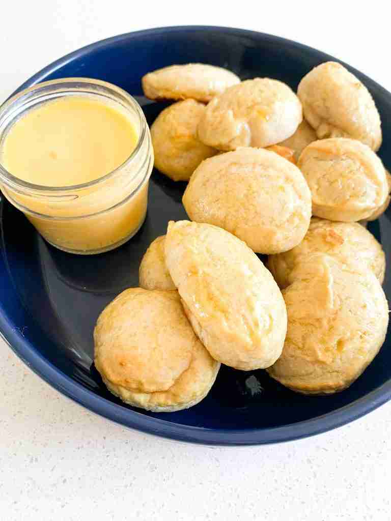 tray of pretzel pieces with a cup of cheese sauce