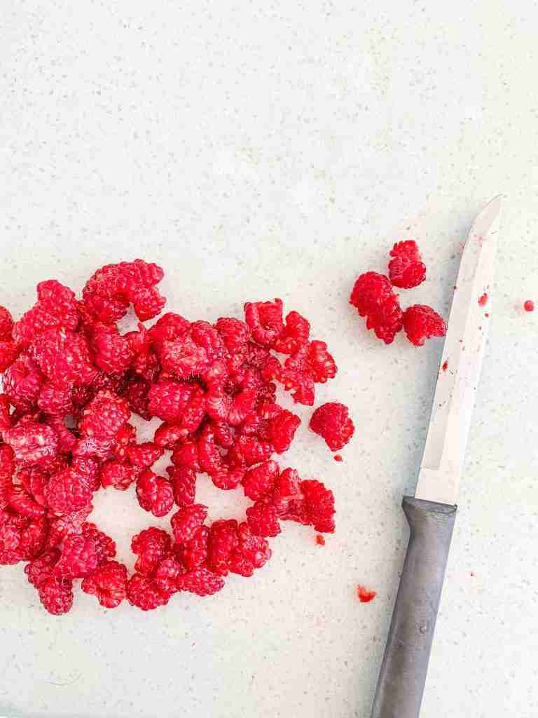 raspberries being chopped up 
