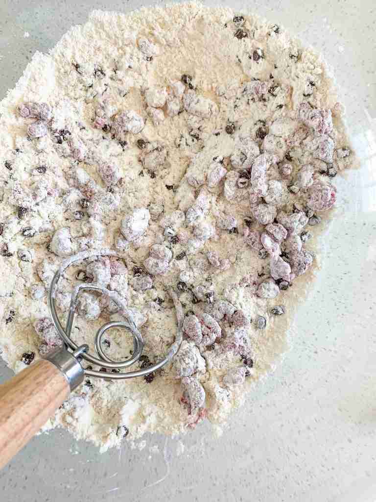 dry ingredients being stirred in a bowl