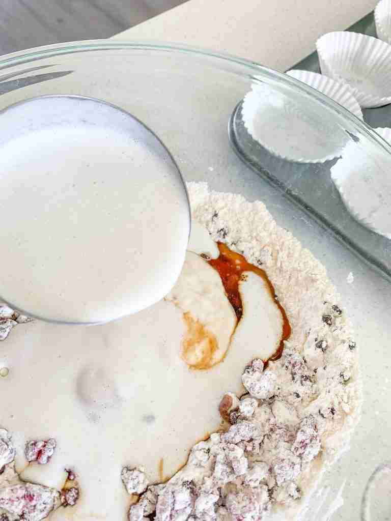 wet ingredients being added into the dry ingredients