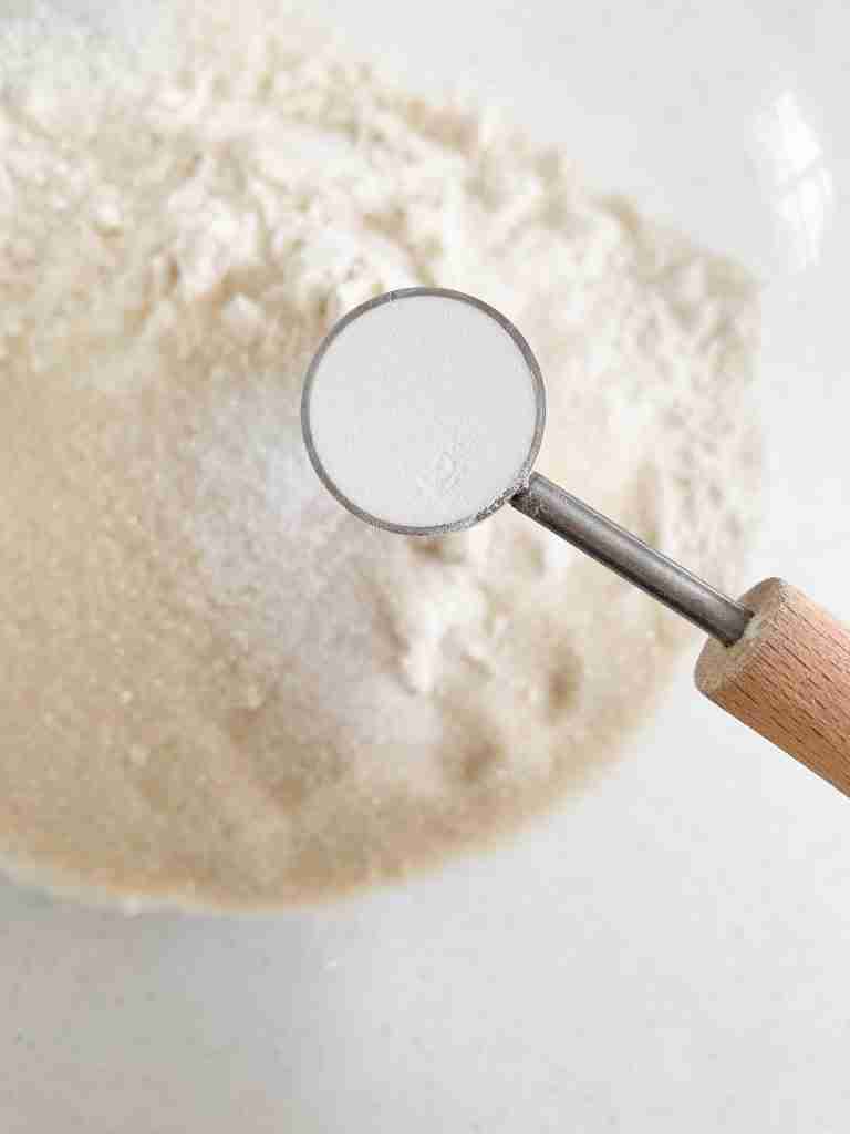 adding ingredients into a bowl 