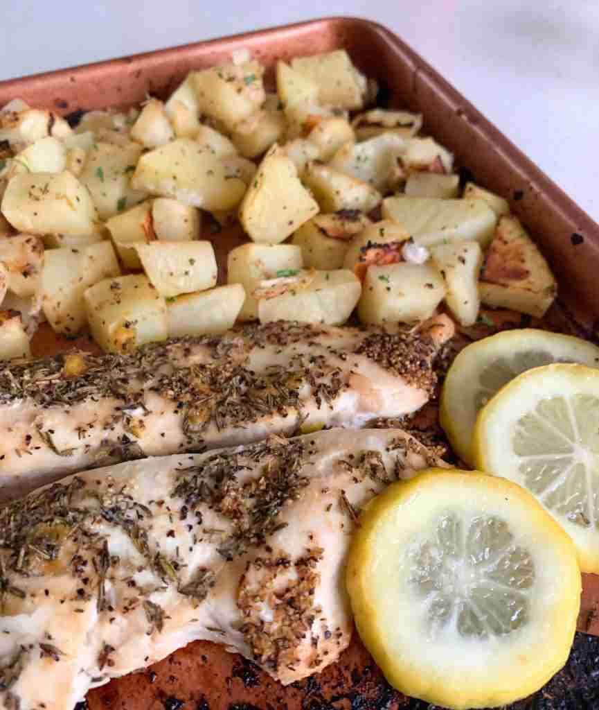 chicken, lemons, and potatoes on a sheet pan 